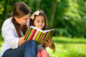 birth mother reading to her child